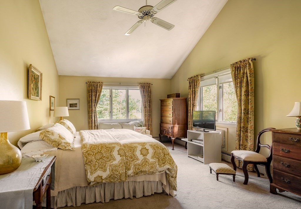 239 Argilla Road Ipswich, MA 01938 - Photo 13 of 37 a bed room with a bed and a couch