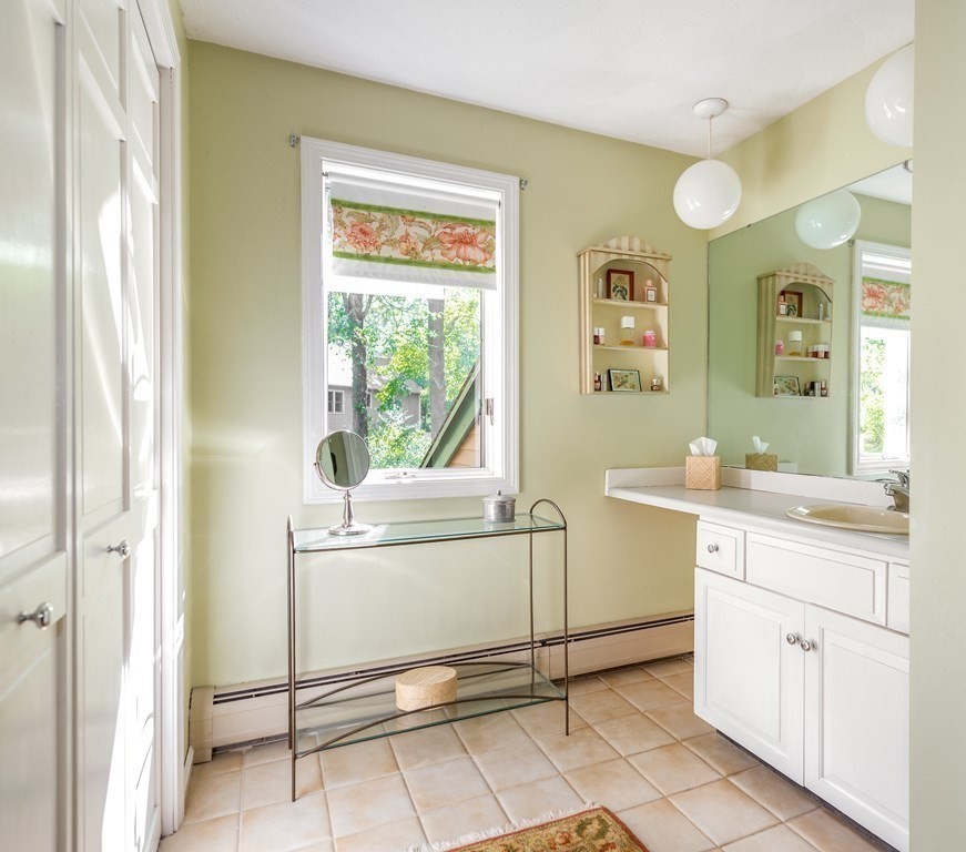 239 Argilla Road Ipswich, MA 01938 - Photo 18 of 37 a spacious bathroom with a granite countertop sink and a mirror