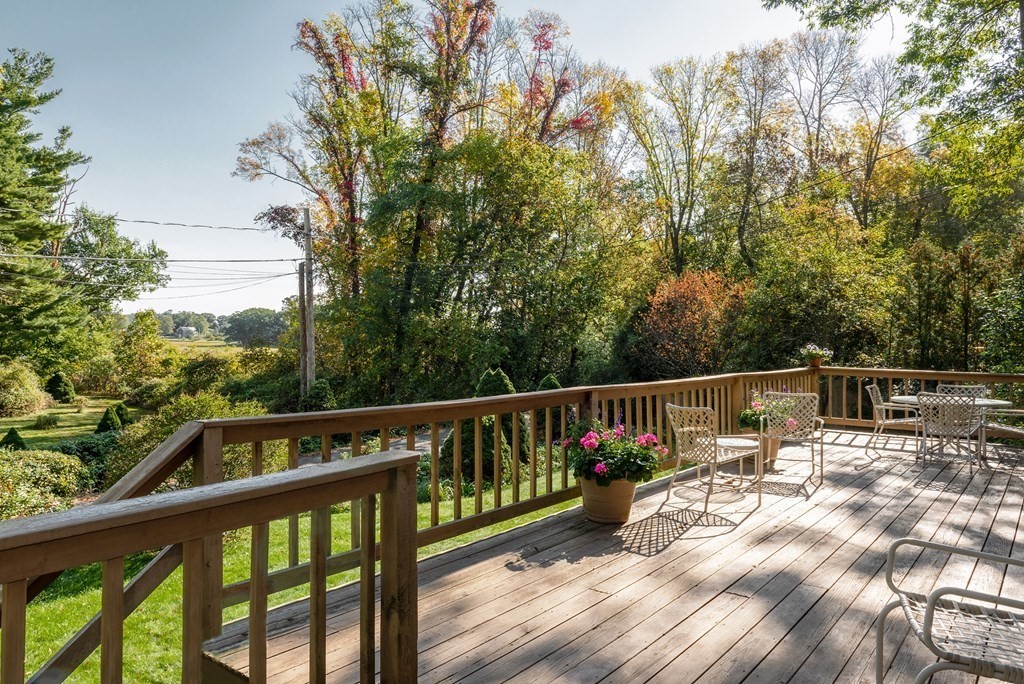 239 Argilla Road Ipswich, MA 01938 - Photo 2 of 37 a view of a balcony with wooden floor and outdoor space
