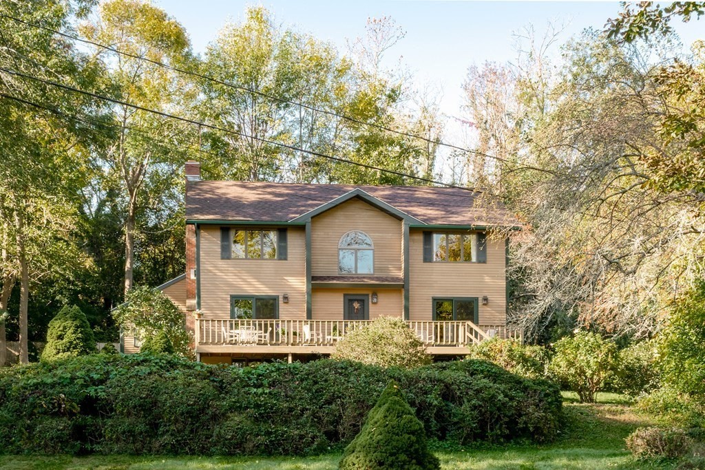 239 Argilla Road Ipswich, MA 01938 - Photo 23 of 37 a front view of a house with a garden