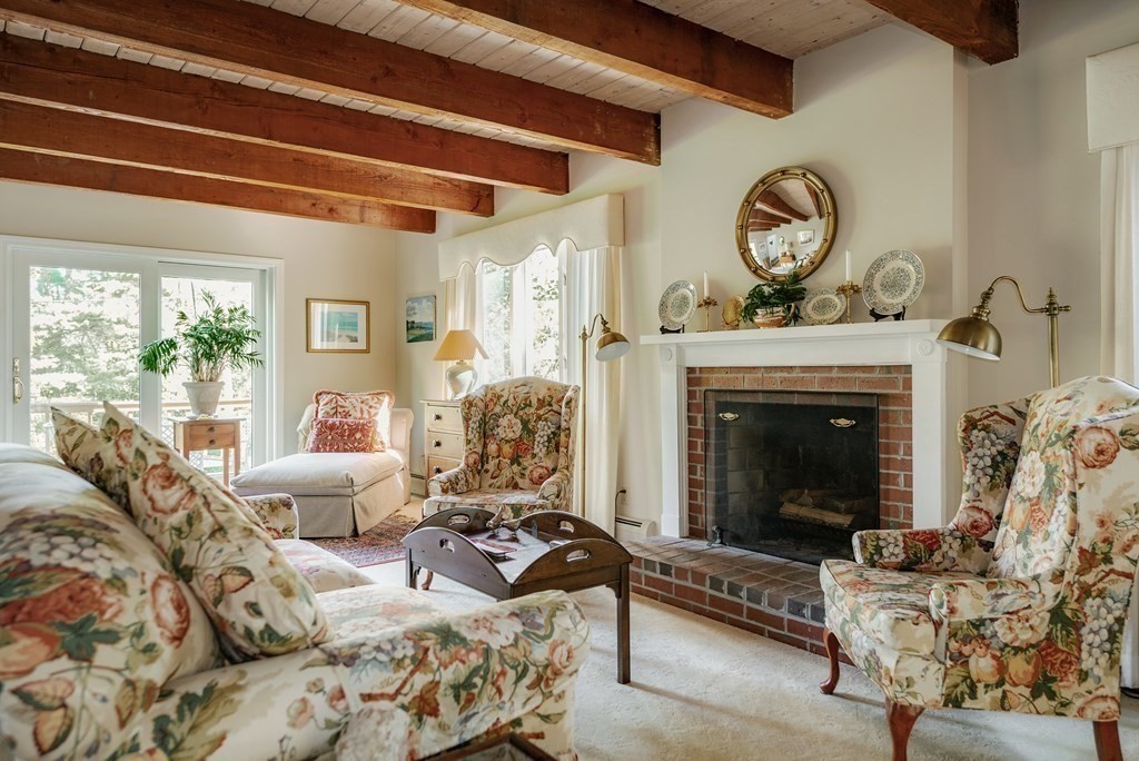 239 Argilla Road Ipswich, MA 01938 - Photo 6 of 37 a living room with furniture a window and a fireplace