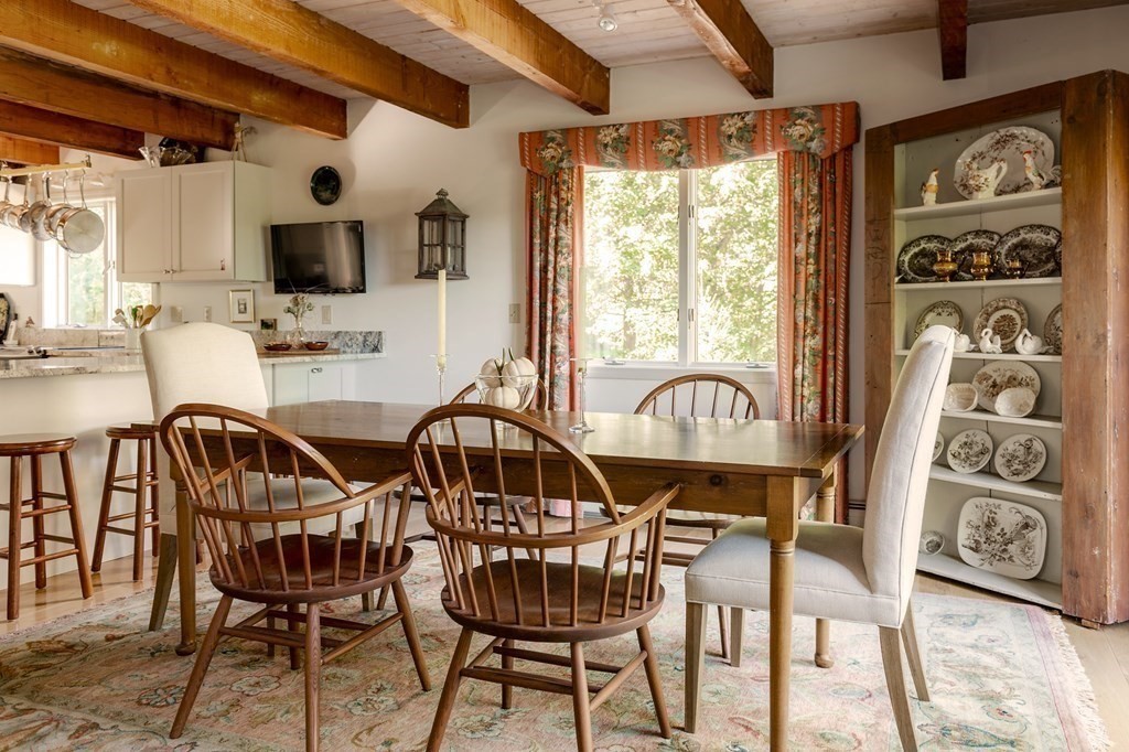 239 Argilla Road Ipswich, MA 01938 - Photo 9 of 37 a view of a dining room with furniture window and outside view