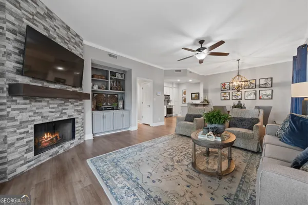 a living room with furniture and a fireplace