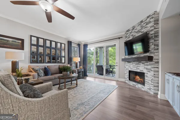 a living room with furniture and a fireplace