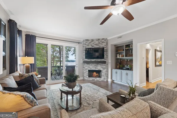 a living room with furniture fireplace and a flat screen tv