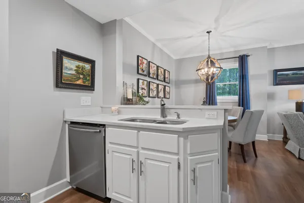 a view of a kitchen with a table and chairs