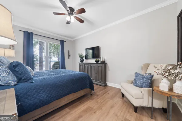 a spacious bedroom with a bed and a couch