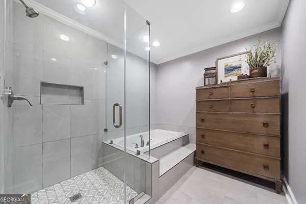 a bathroom with a bathtub and a sink