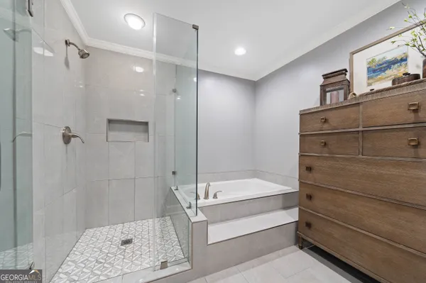 a bathroom with a bathtub and a shower