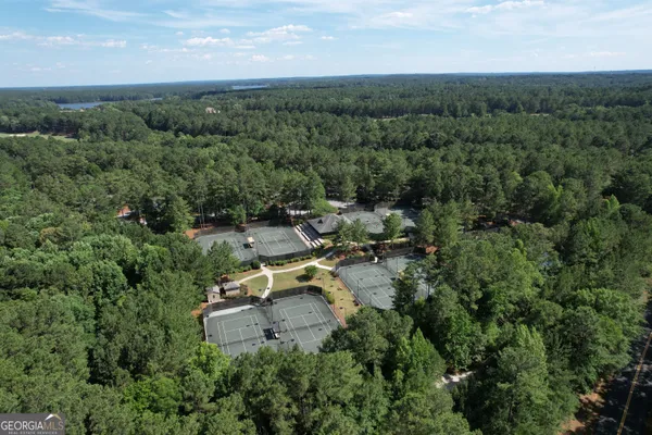 an aerial view of a house with mountain view