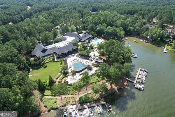 an aerial view of residential house with outdoor space and lake view
