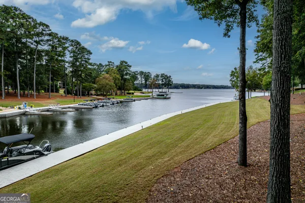 a view of a lake with houses in the back