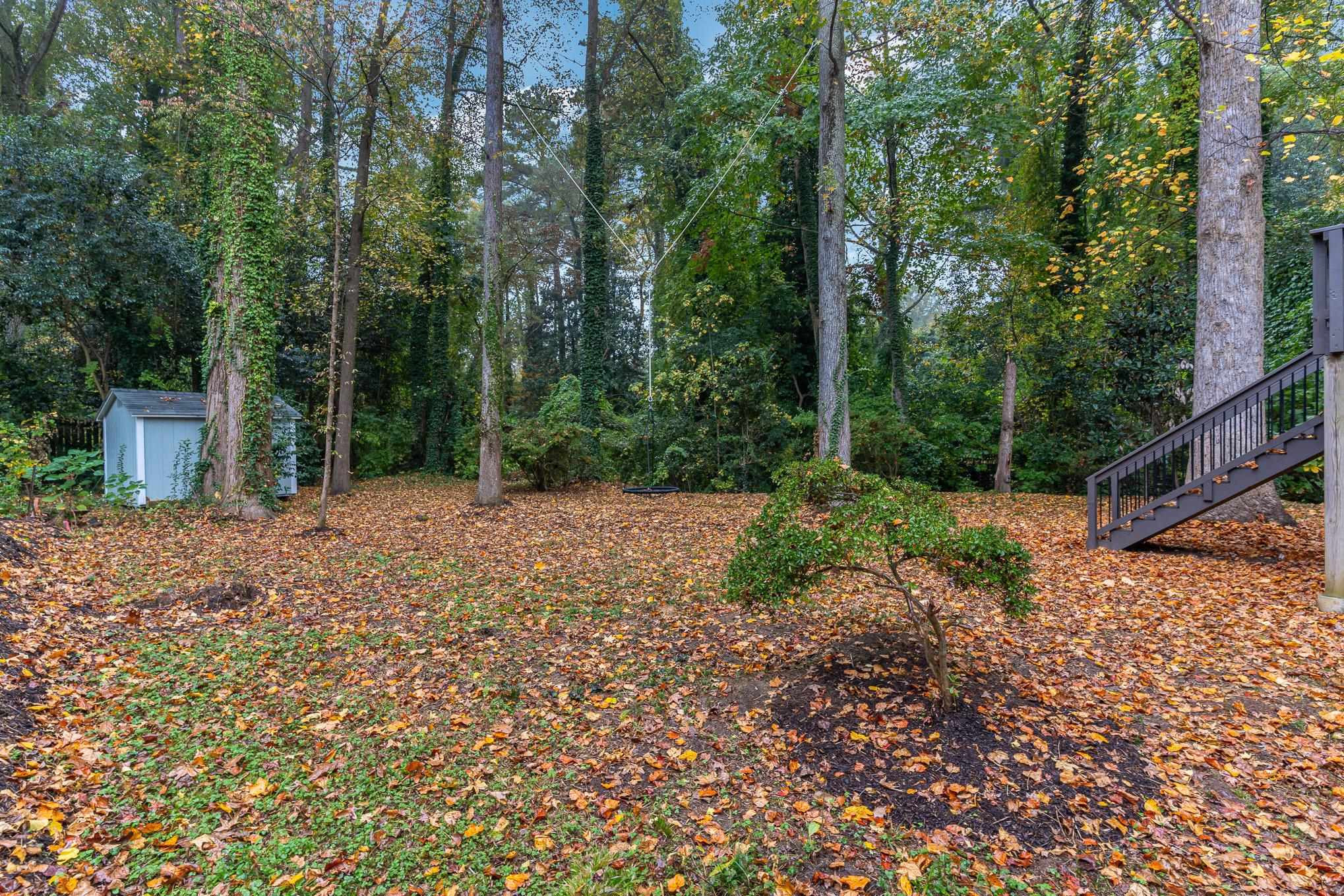 2811 Gordon Street Raleigh, NC 27608 - Photo 12 of 33 a view of a backyard with large trees