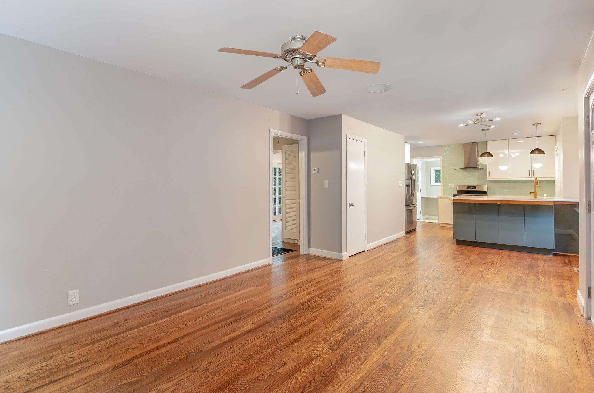 2811 Gordon Street Raleigh, NC 27608 - Photo 20 of 33 a view of a kitchen with a sink dishwasher a refrigerator with wooden floor