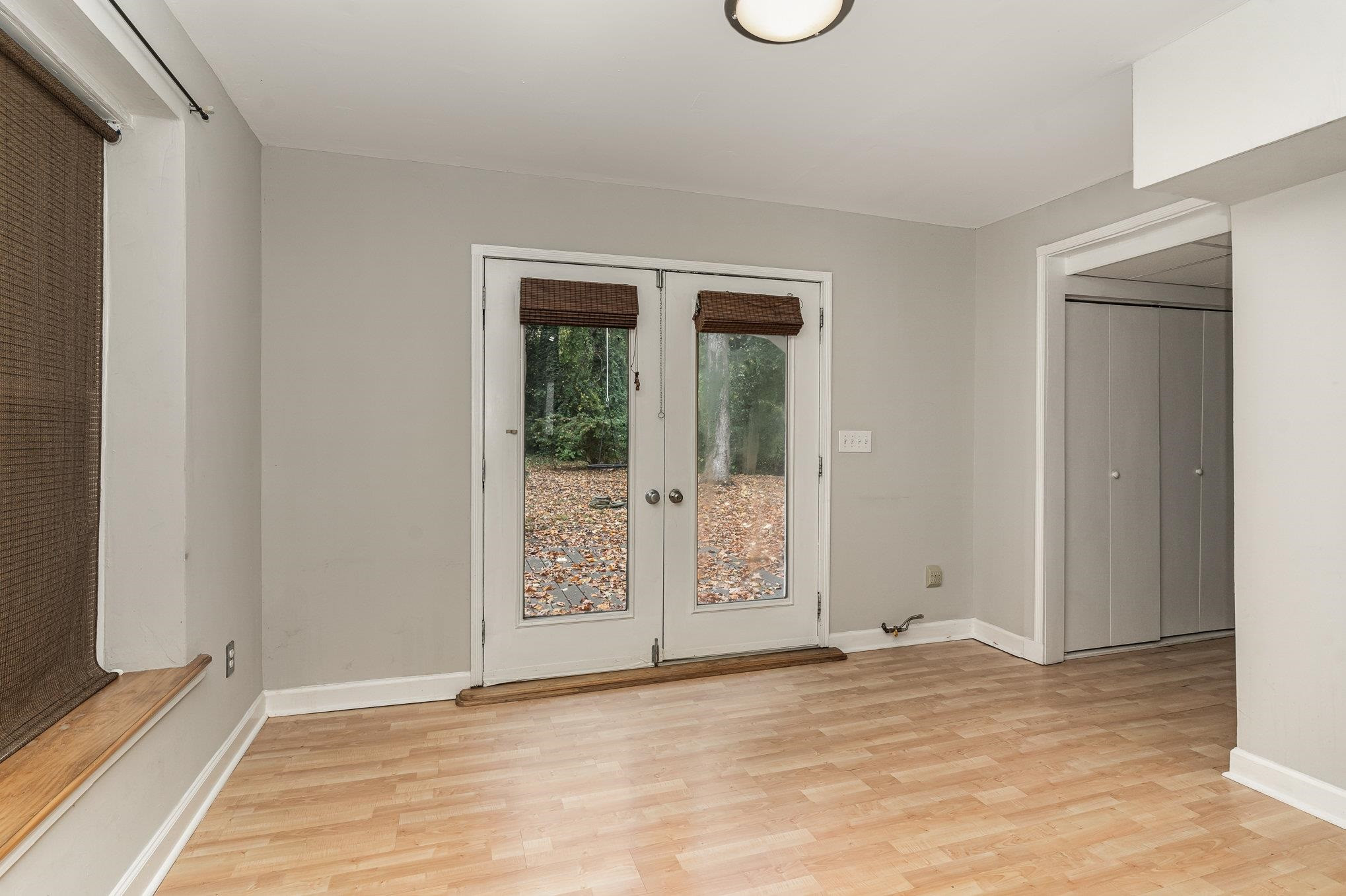 2811 Gordon Street Raleigh, NC 27608 - Photo 32 of 33 a view of an empty room with window and wooden floor