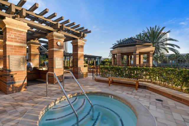 a view of a palm trees front of house with palm trees