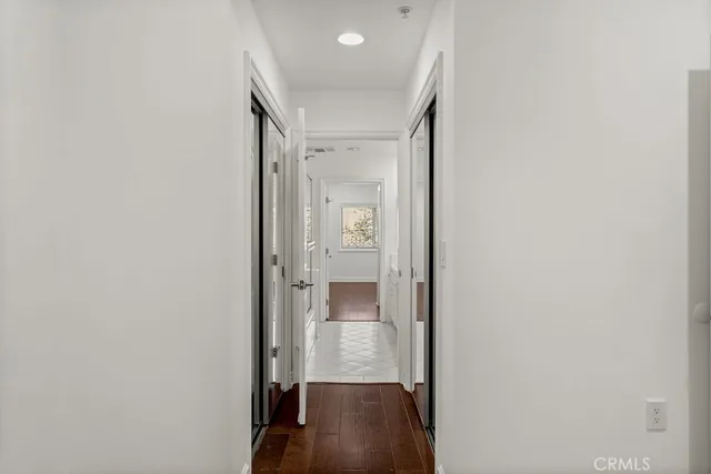 a view of an entryway with wooden floor