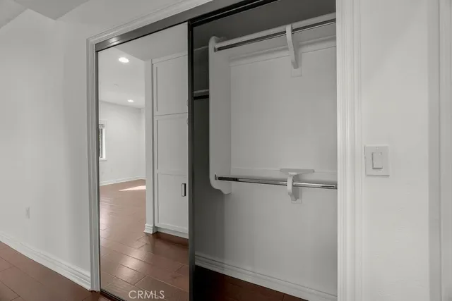 a view of a balcony with wooden floor