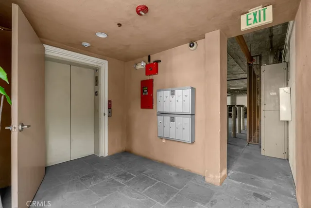 a kitchen with stainless steel appliances a refrigerator stove and microwave