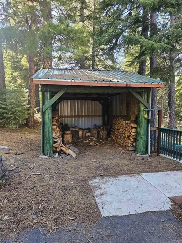 a view of a wooden house with a trees