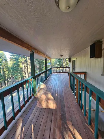 a view of balcony with wooden floor