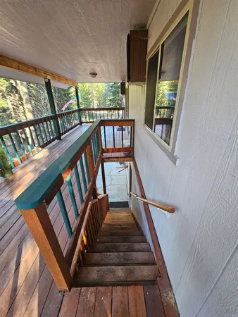 a view of staircase with lots of wooden floor