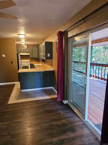 a view of kitchen with cabinets and wooden floor