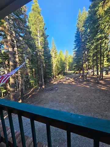 a view of street from balcony with outdoor space