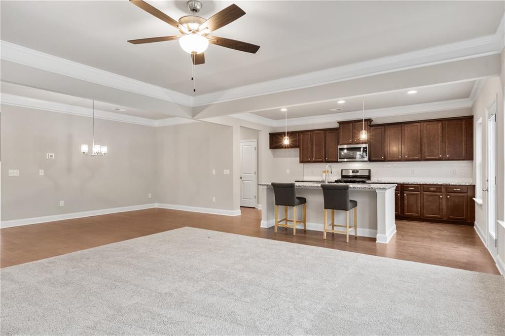 5571 Overview Drive Flowery Branch, GA 30542 - Photo 12 of 38 a view of kitchen with microwave and cabinets
