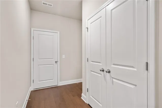 an view of a room with wooden floor