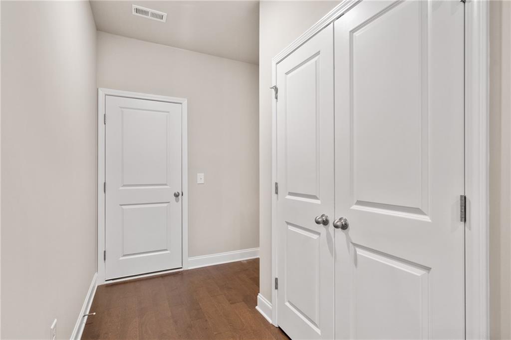 5571 Overview Drive Flowery Branch, GA 30542 - Photo 17 of 38 an view of a room with wooden floor