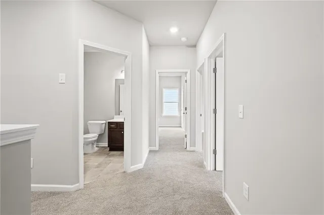 a view of a bathroom with a sink and a mirror