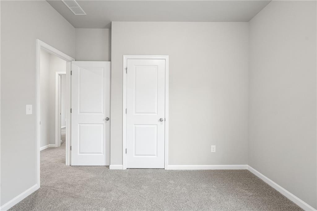 5571 Overview Drive Flowery Branch, GA 30542 - Photo 21 of 38 a view of an empty room