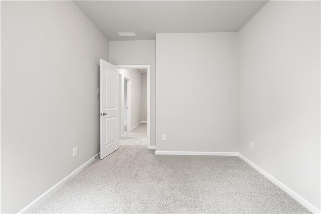 5571 Overview Drive Flowery Branch, GA 30542 - Photo 26 of 38 a view of an empty room