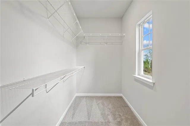 a view of an empty room with windows