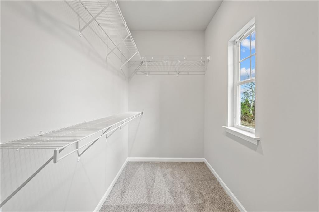 5571 Overview Drive Flowery Branch, GA 30542 - Photo 30 of 38 a view of an empty room with windows