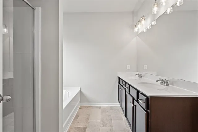a bathroom with a double vanity sink and a mirror
