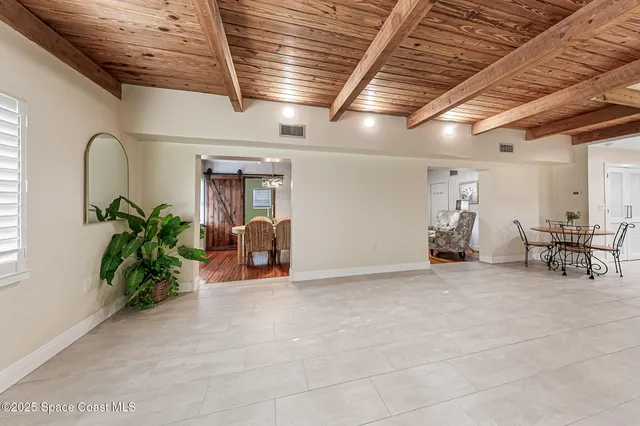 a big room with plants and large trees