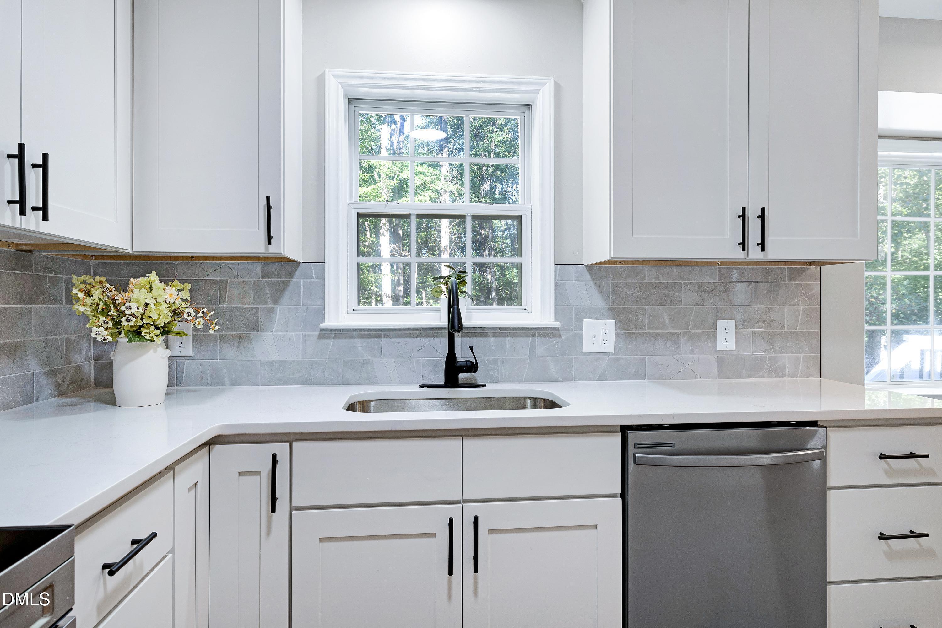 1508 Middle Ridge Drive Willow Spring, NC 27592 - Photo 15 of 56 a kitchen with a sink and cabinets
