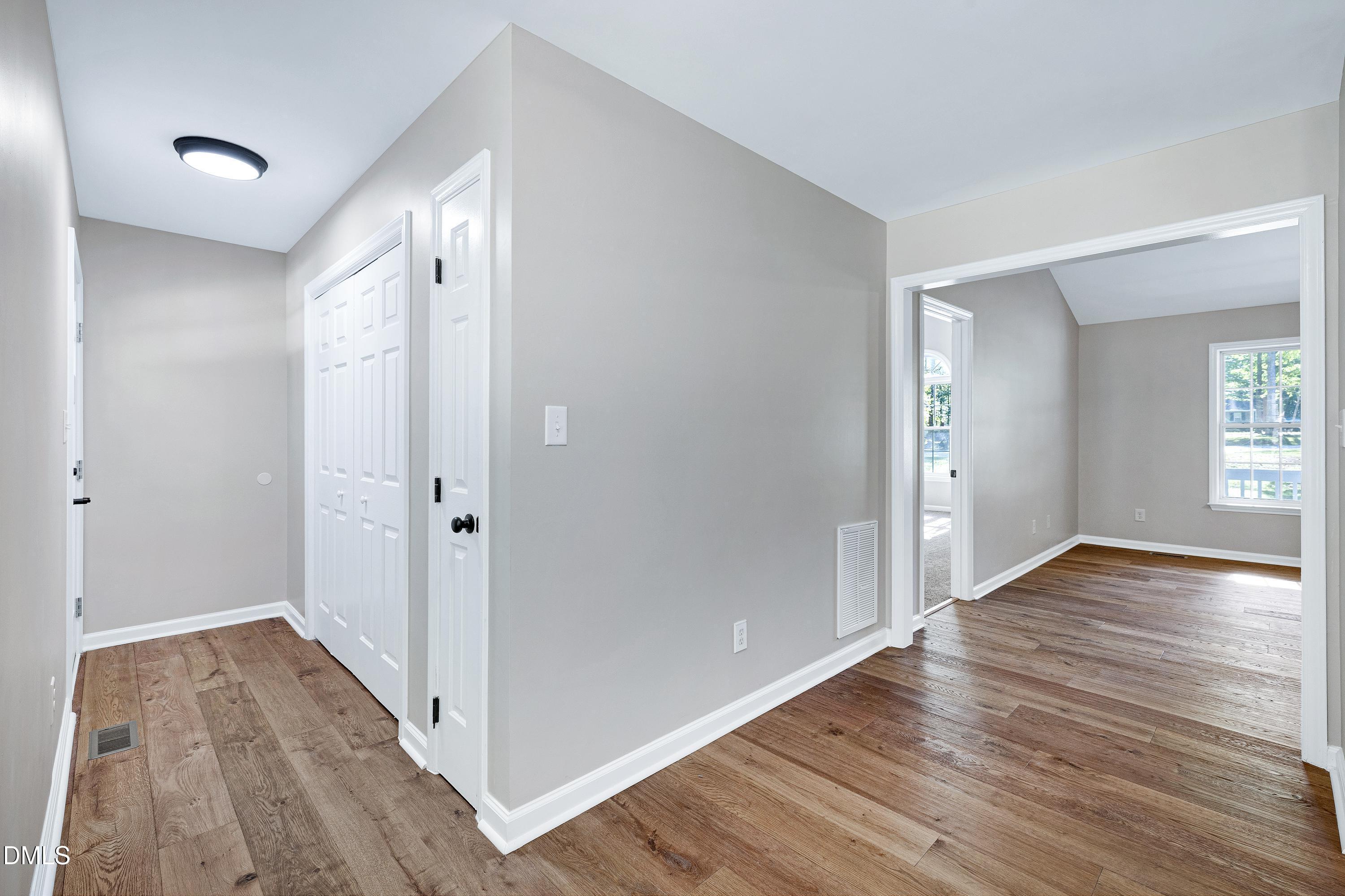 1508 Middle Ridge Drive Willow Spring, NC 27592 - Photo 17 of 56 a view of hallway with wooden floor
