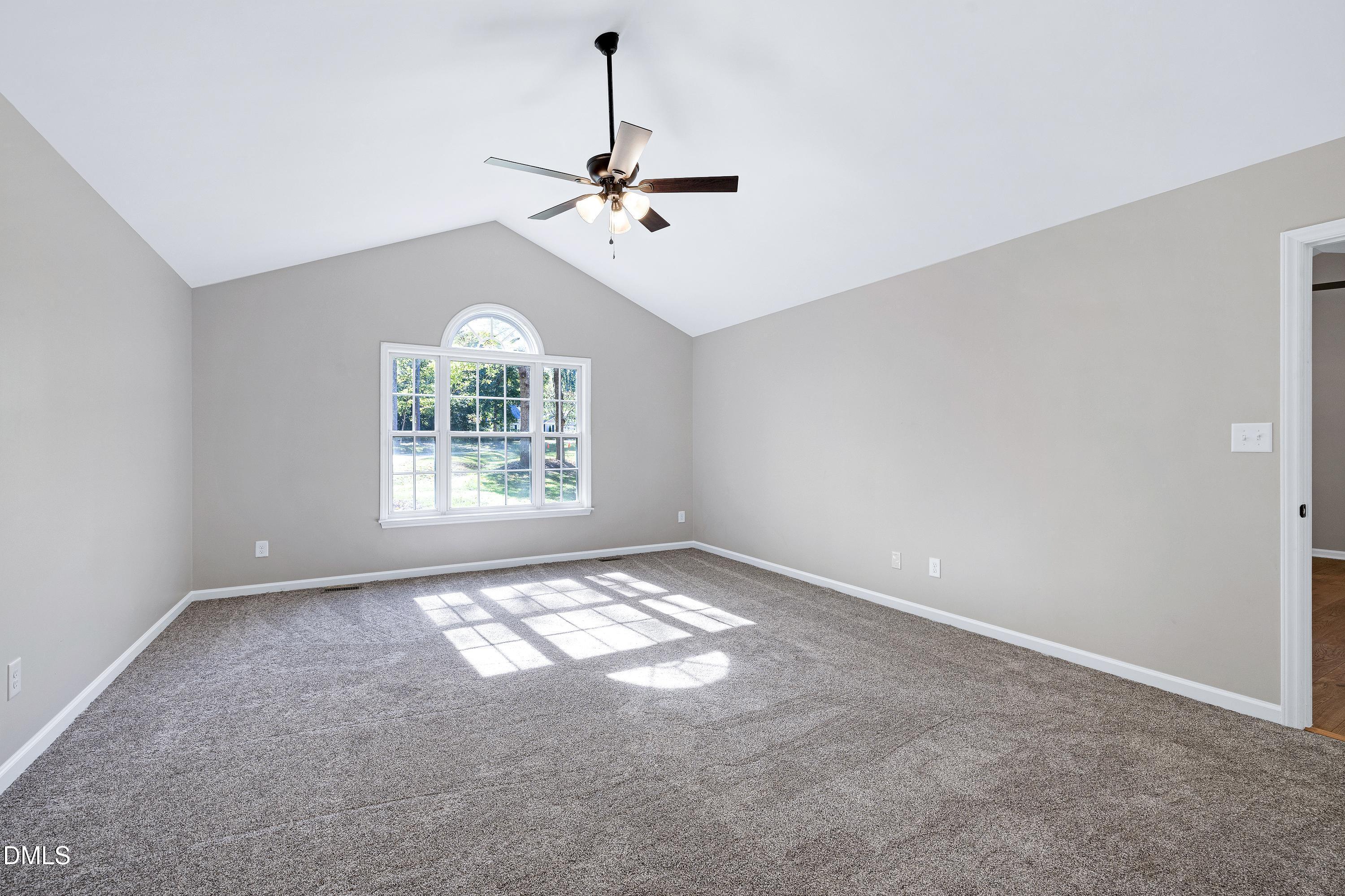 1508 Middle Ridge Drive Willow Spring, NC 27592 - Photo 21 of 56 a view of an empty room with windows