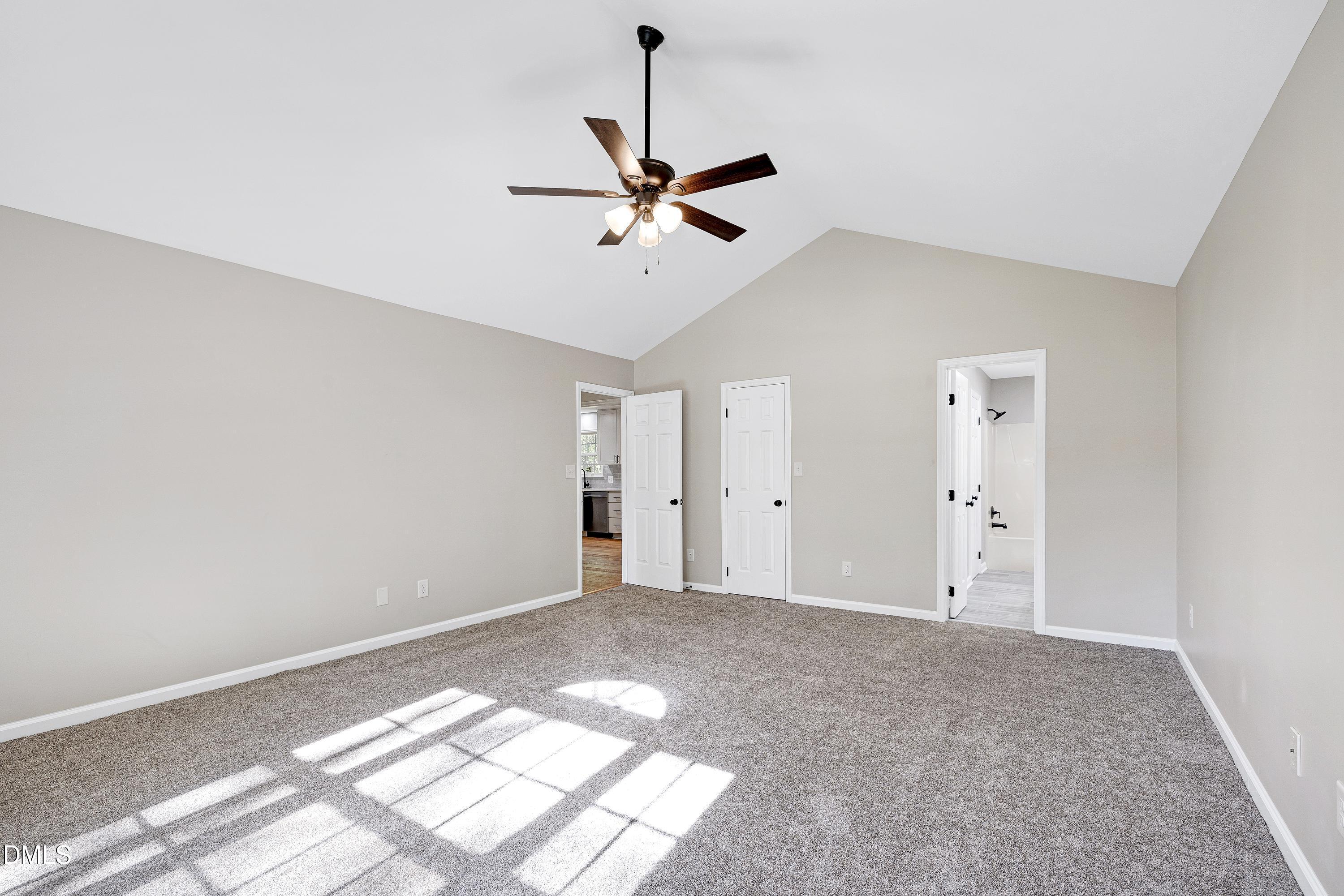 1508 Middle Ridge Drive Willow Spring, NC 27592 - Photo 22 of 56 a view of a big room with carpet and windows