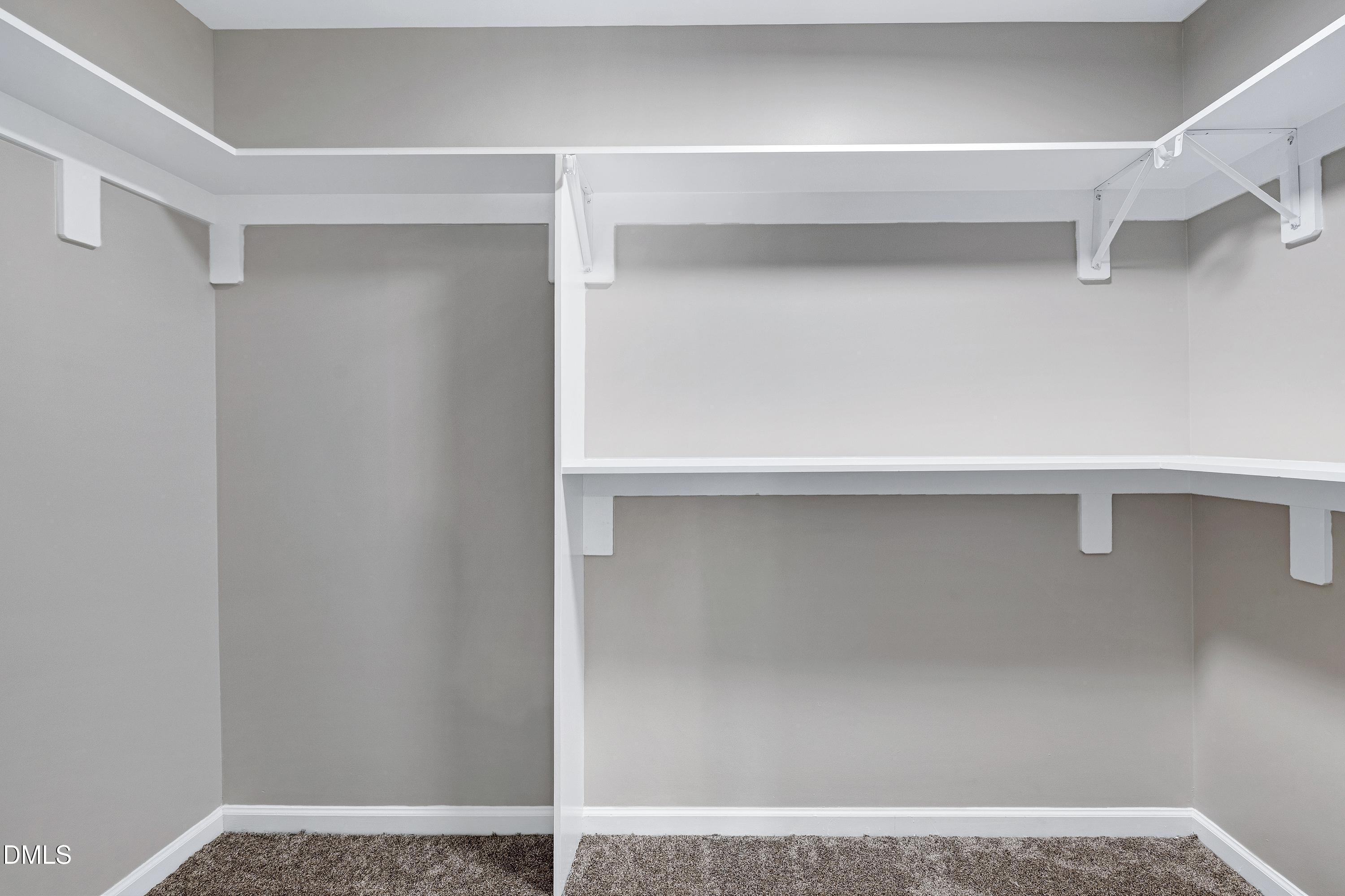 1508 Middle Ridge Drive Willow Spring, NC 27592 - Photo 27 of 56 a view of walk in closet with empty racks