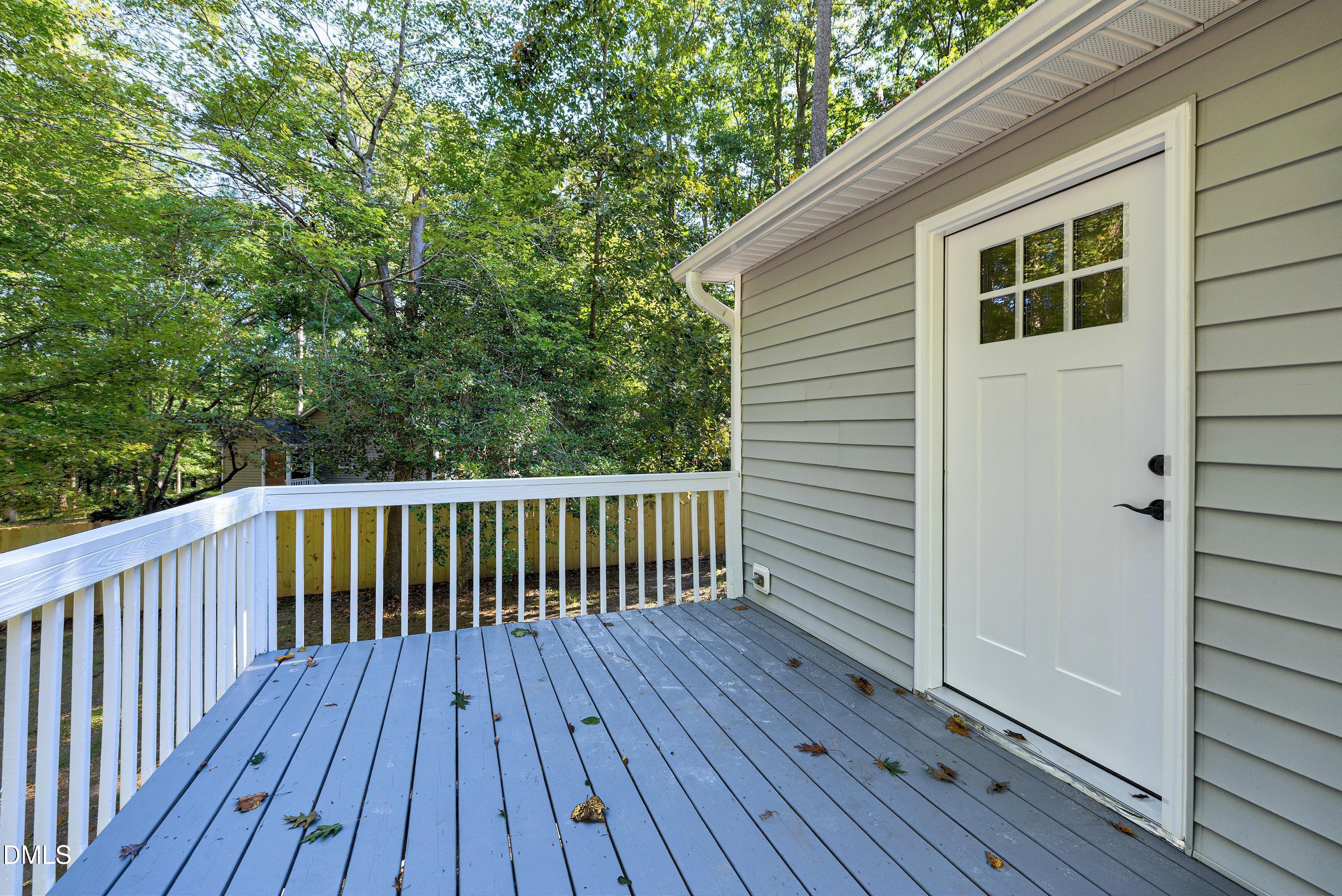 1508 Middle Ridge Drive Willow Spring, NC 27592 - Photo 34 of 56 a view of deck with wooden floor and fence