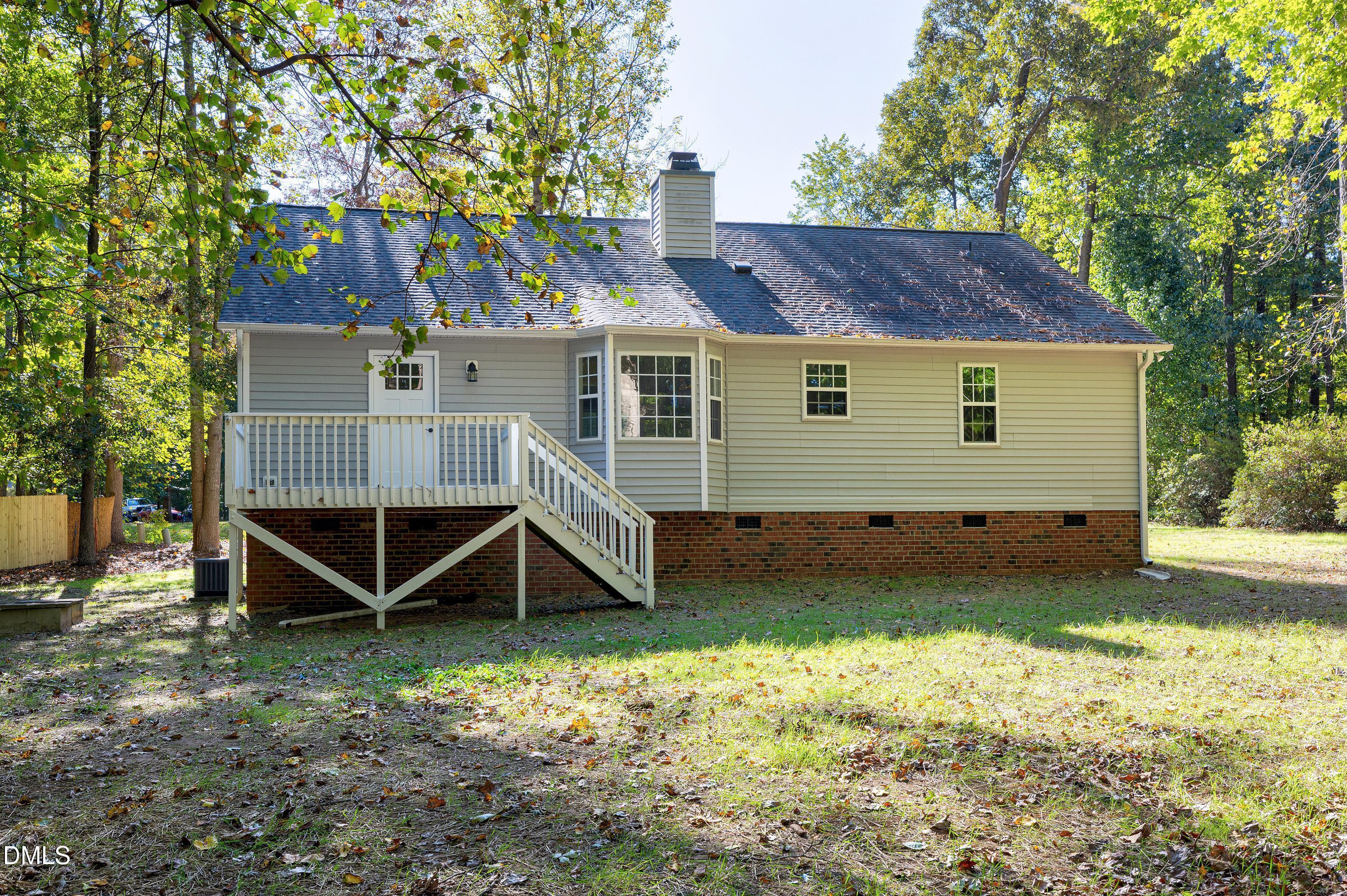 1508 Middle Ridge Drive Willow Spring, NC 27592 - Photo 40 of 56 a view of a house with a yard and wooden fence