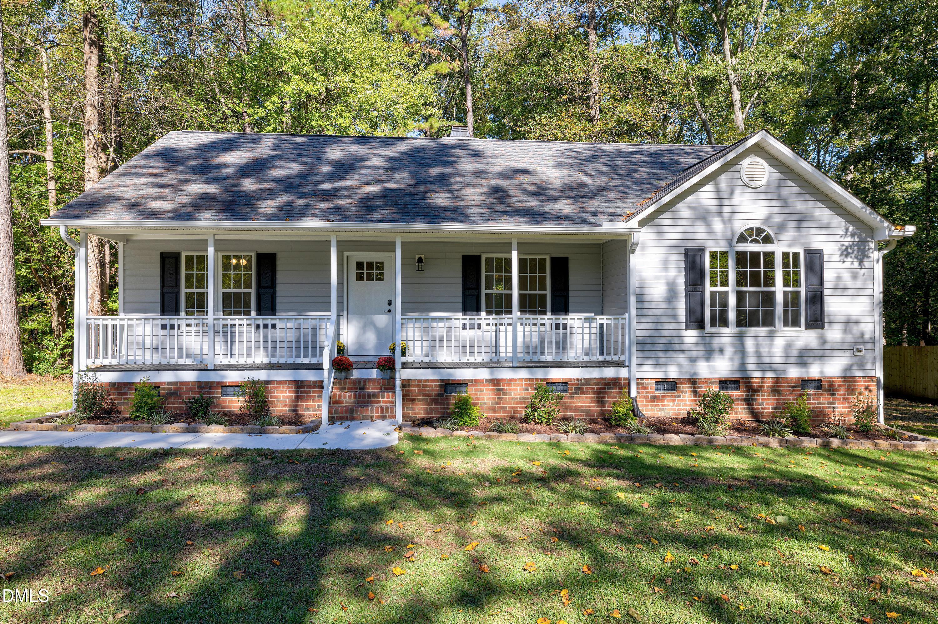 1508 Middle Ridge Drive Willow Spring, NC 27592 - Photo 5 of 56 a view of a house with a yard and sitting area