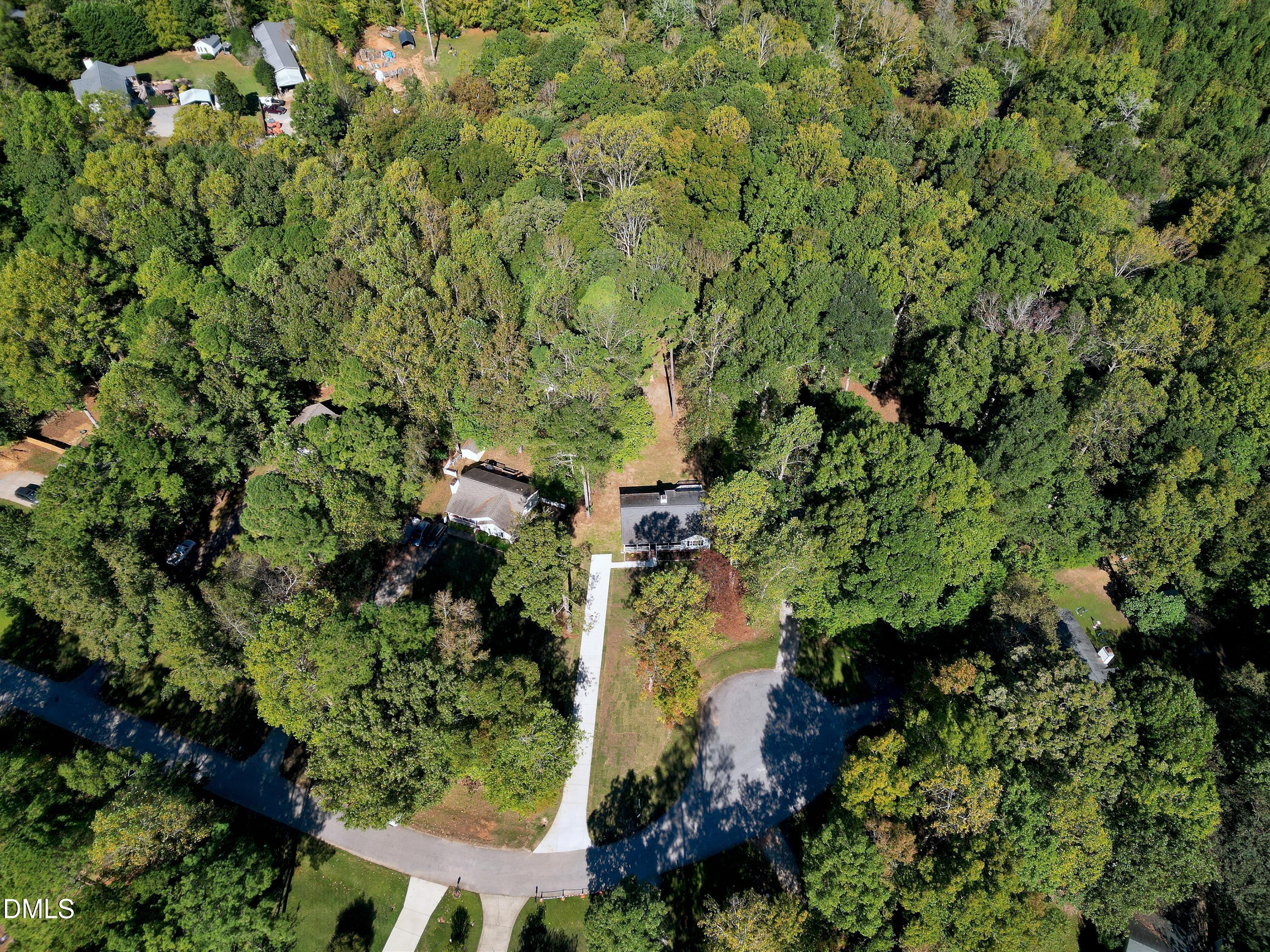 1508 Middle Ridge Drive Willow Spring, NC 27592 - Photo 52 of 56 an aerial view of residential house with outdoor space and trees all around