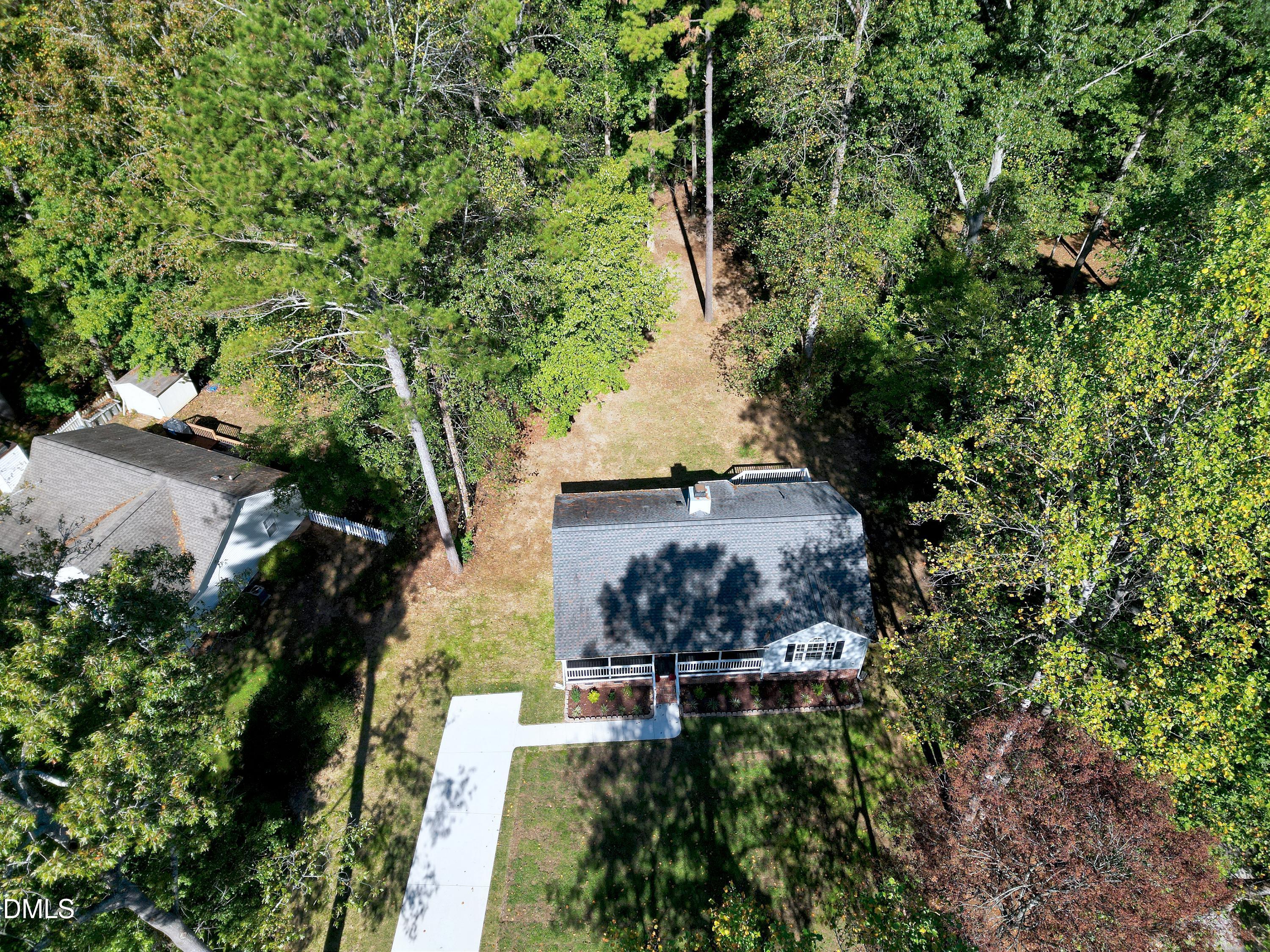 1508 Middle Ridge Drive Willow Spring, NC 27592 - Photo 55 of 56 an aerial view of a house with a yard and large trees