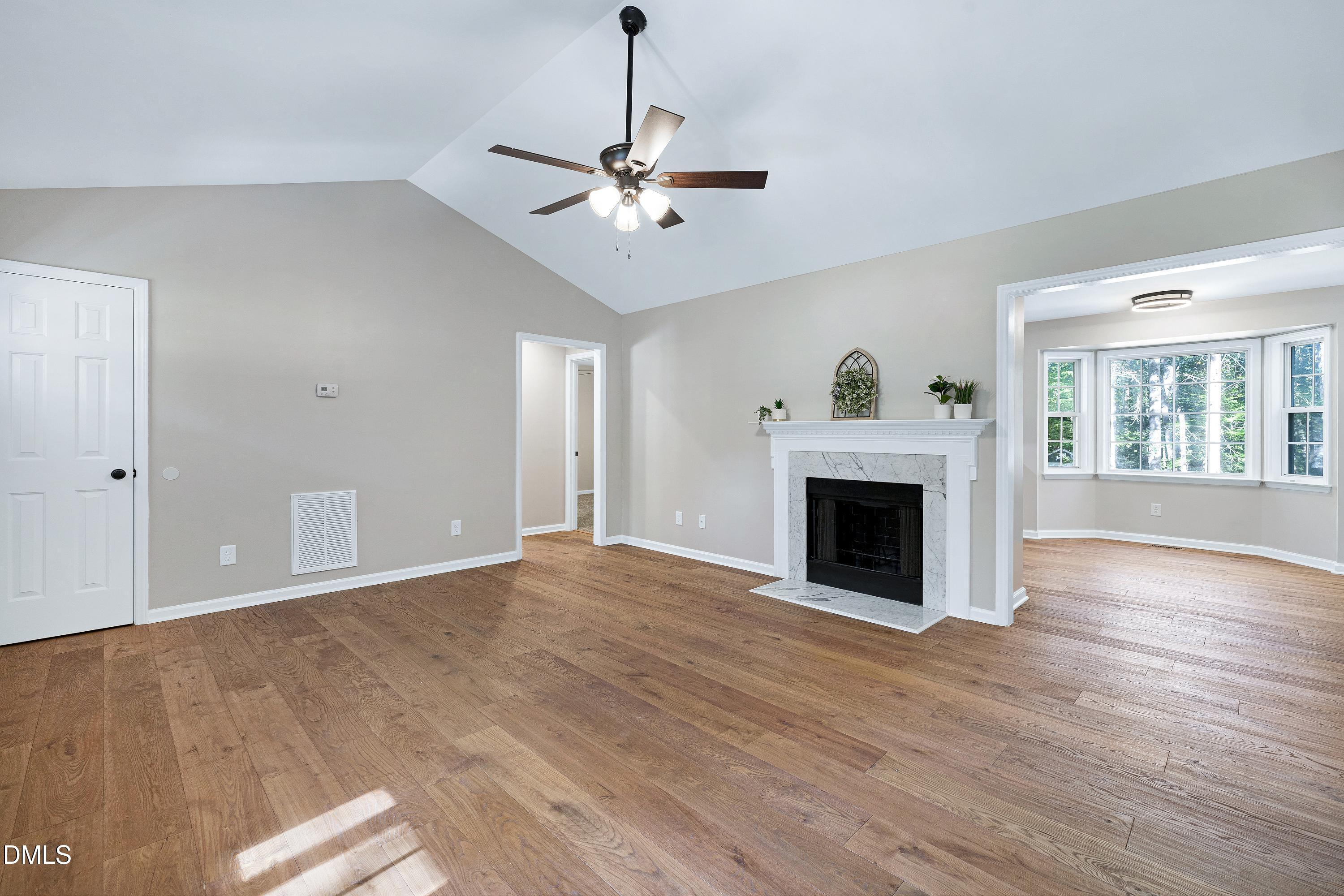 1508 Middle Ridge Drive Willow Spring, NC 27592 - Photo 7 of 56 a view of a livingroom with a fireplace window and wooden floor