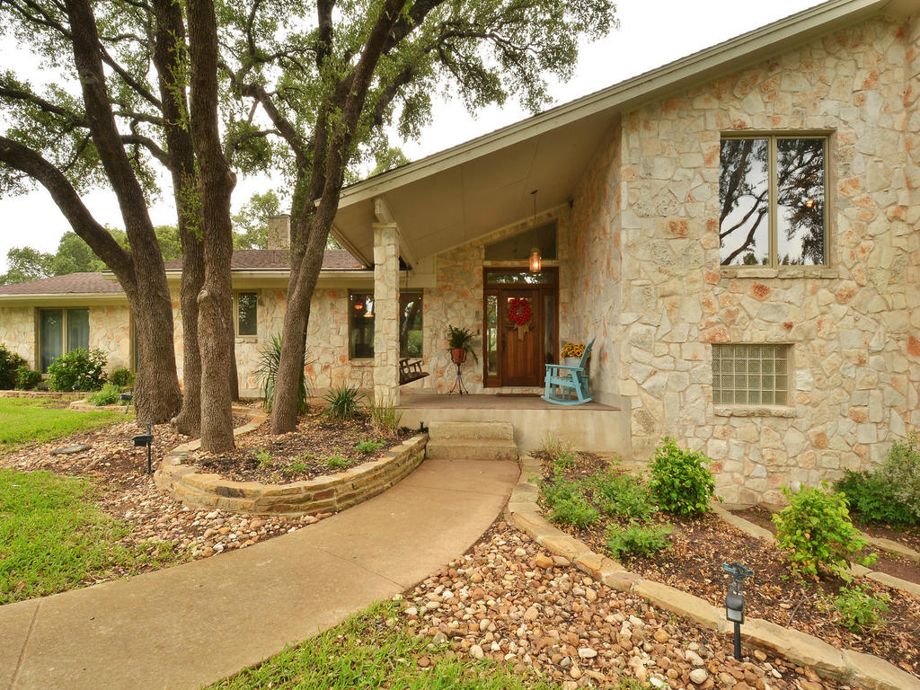 424 Greenridge Road Georgetown, TX 78628 - Photo 1 of 1 a front view of a house with garden